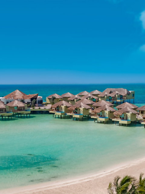 Discover Tropical Romance in 3 Overwater Bungalow Resorts on the Caribbean Sea
